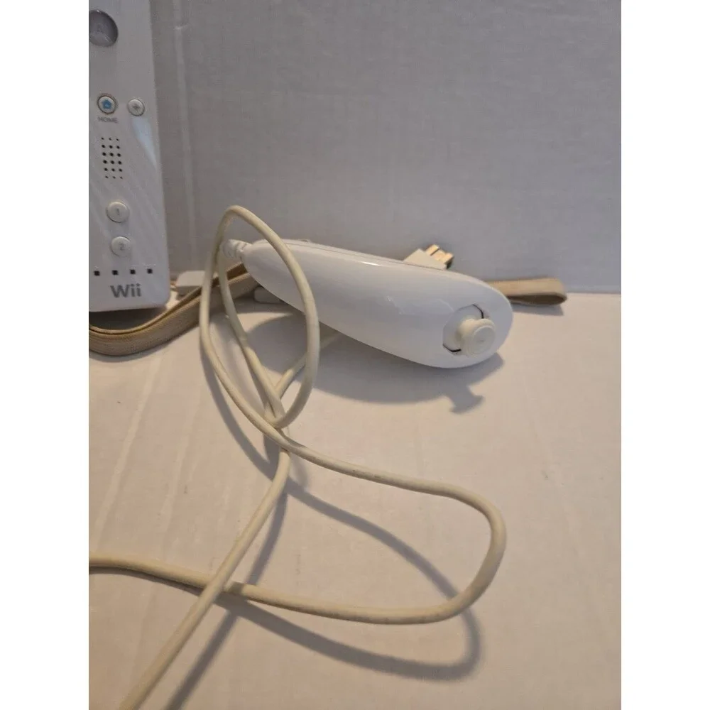 Pair Of Nintendo Wii Remotes With Nunchucks